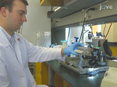 "Stephen Shuford of Clemson University demonstrating the inkjet printer conversion process in the JoVE video "Creating Transient Cell Membrane Pores Using a Standard Inkjet Printer."